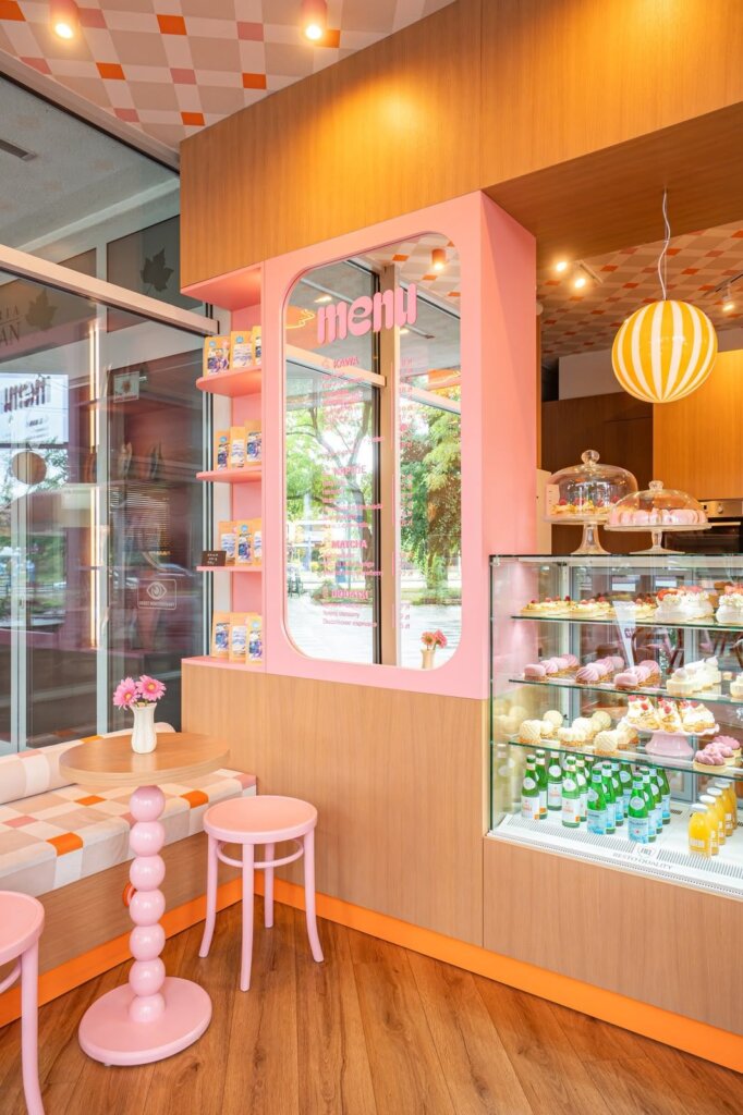 Ma Ma Cafe bar with a dessert display and glass domes of meringues