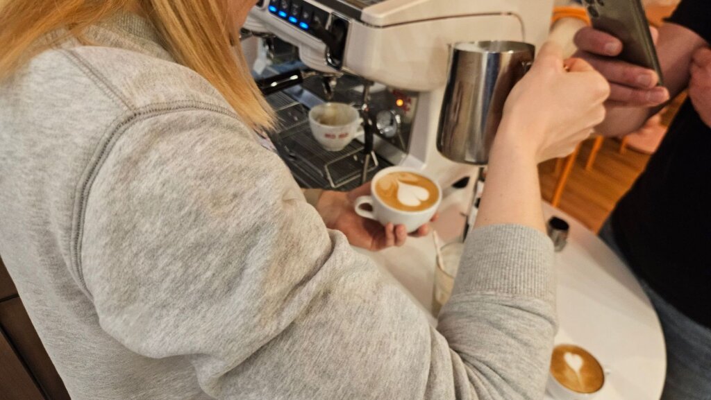 Barista training at Ma Ma Cafe: steaming milk and latte art