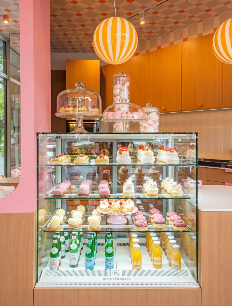 Chilled display with desserts, water and juices at Ma Ma Cafe